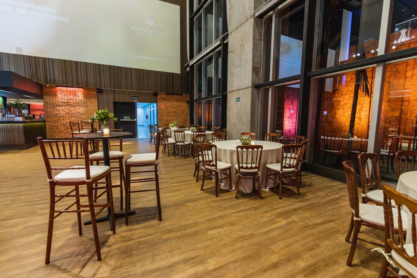 An event hall with round tables set for a function